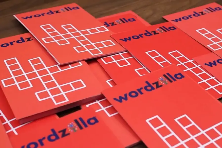 Red Wordzilla word-puzzle cards spread across a table